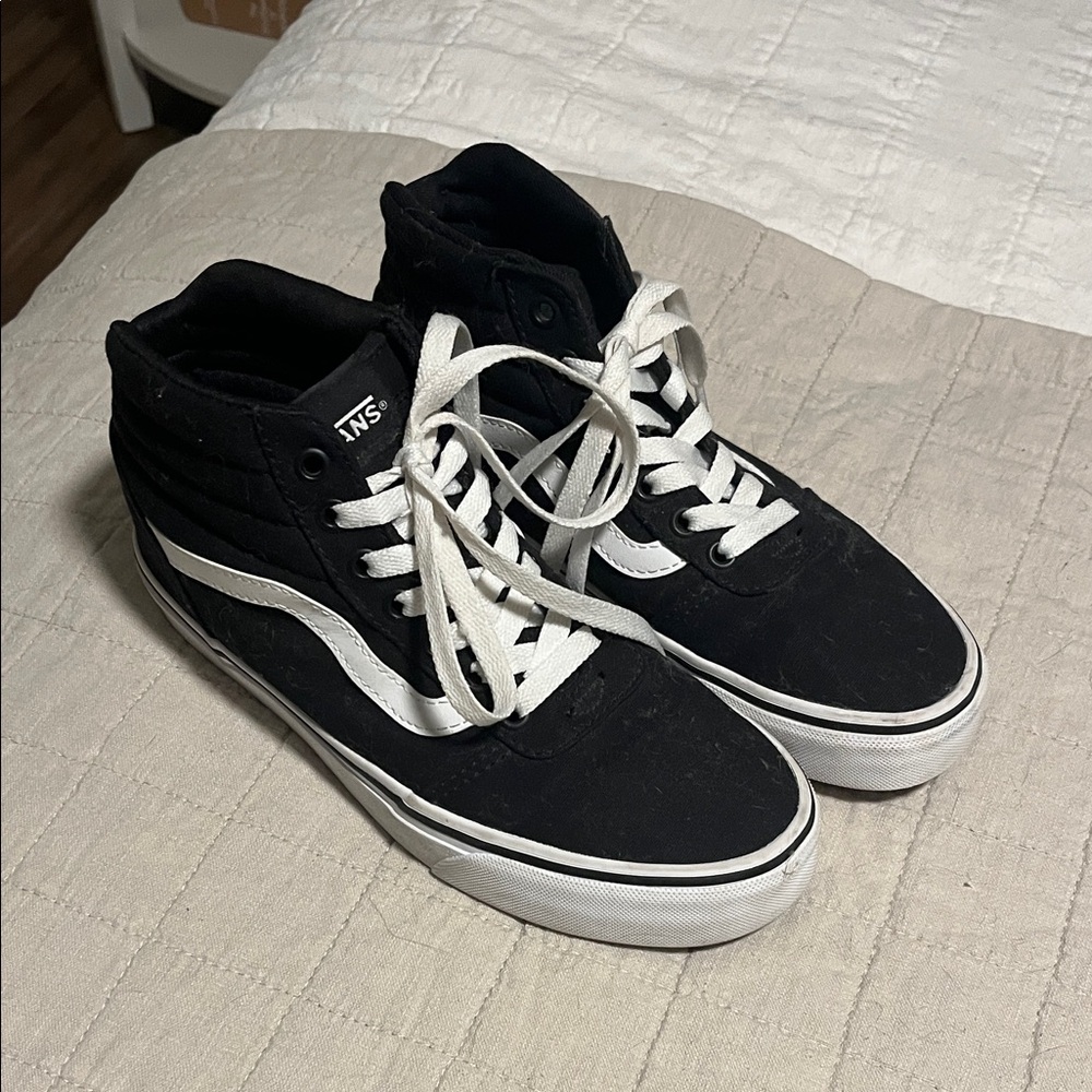 Vans women’s Black and White High-Top Sneakers